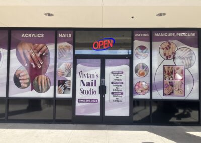 Vivian's Nail Studio storefront in Phoenix features acrylics, nails, waxing, and pedicure signage by Arizona Custom Signworks. Open hours displayed.