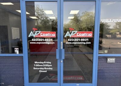 Glass doors of AVP Coating in Glendale, Arizona, displaying business hours, contact info, and signage by Arizona Custom Signworks.