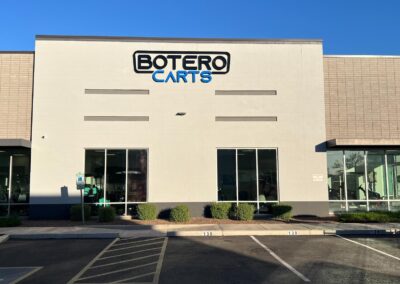 Commercial building with Botero Carts signage by Arizona Custom Signworks, located in a Phoenix suburb. Modern facade and parking area.