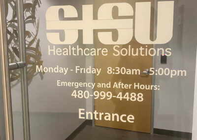 Glass door signage for SISU Healthcare Solutions, Suite 103, displaying hours and contact info. Designed by Arizona Custom Signworks, Phoenix.