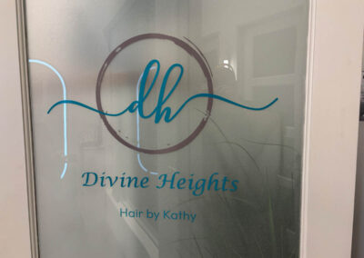 Frosted glass door with Divine Heights, Hair by Kathy logo, designed by Arizona Custom Signworks, located in Phoenix, Arizona salon.
