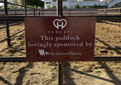 Hunkapi paddock sign sponsored by Meadows Bank in Arizona. Custom signage by Arizona Custom Signworks, perfect for businesses in Phoenix.
